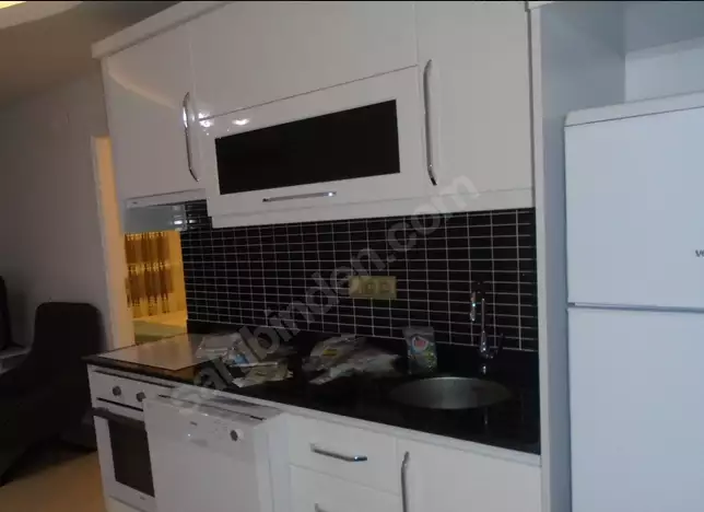 Доступное (1+1) жилье в самом интернациональном районе Алании - В МАХМУТЛАРЕ.