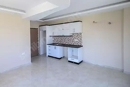 Доступное (1+1) жилье в самом интернациональном районе Алании - В МАХМУТЛАРЕ.