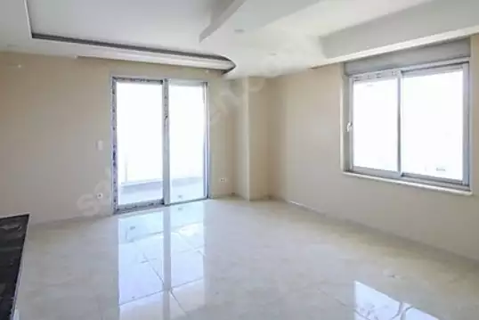 Доступное (1+1) жилье в самом интернациональном районе Алании - В МАХМУТЛАРЕ.