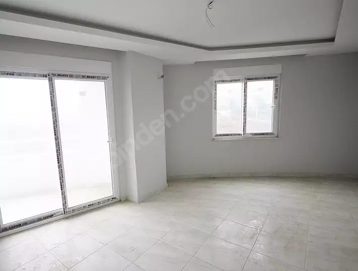 Доступное (1+1) жилье в самом интернациональном районе Алании - В МАХМУТЛАРЕ.