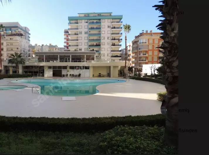 Доступное (1+1) жилье в самом интернациональном районе Алании - В МАХМУТЛАРЕ.