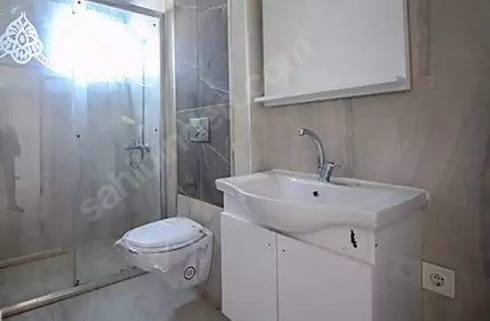 Доступное (1+1) жилье в самом интернациональном районе Алании - В МАХМУТЛАРЕ.