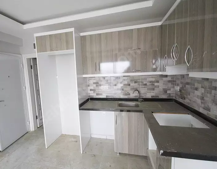 Доступное (1+1) жилье в самом интернациональном районе Алании - В МАХМУТЛАРЕ.