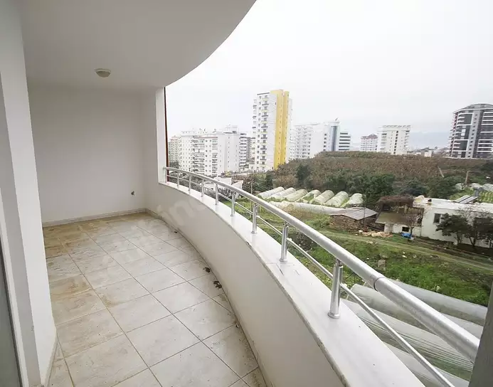 Доступное (1+1) жилье в самом интернациональном районе Алании - В МАХМУТЛАРЕ.