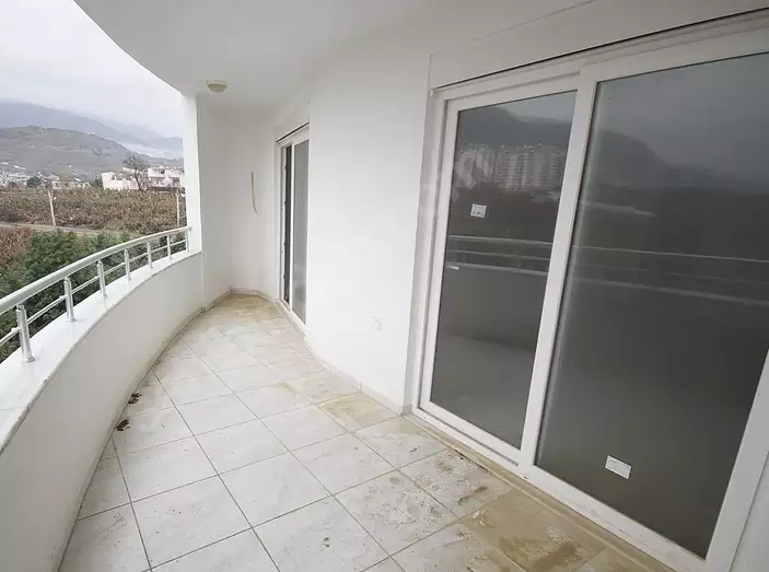 Доступное (1+1) жилье в самом интернациональном районе Алании - В МАХМУТЛАРЕ.