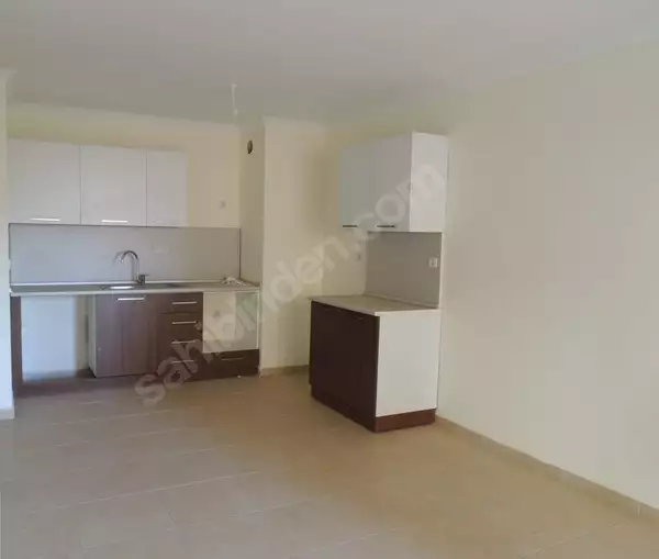 Доступное (1+1) жилье в самом интернациональном районе Алании - В МАХМУТЛАРЕ.